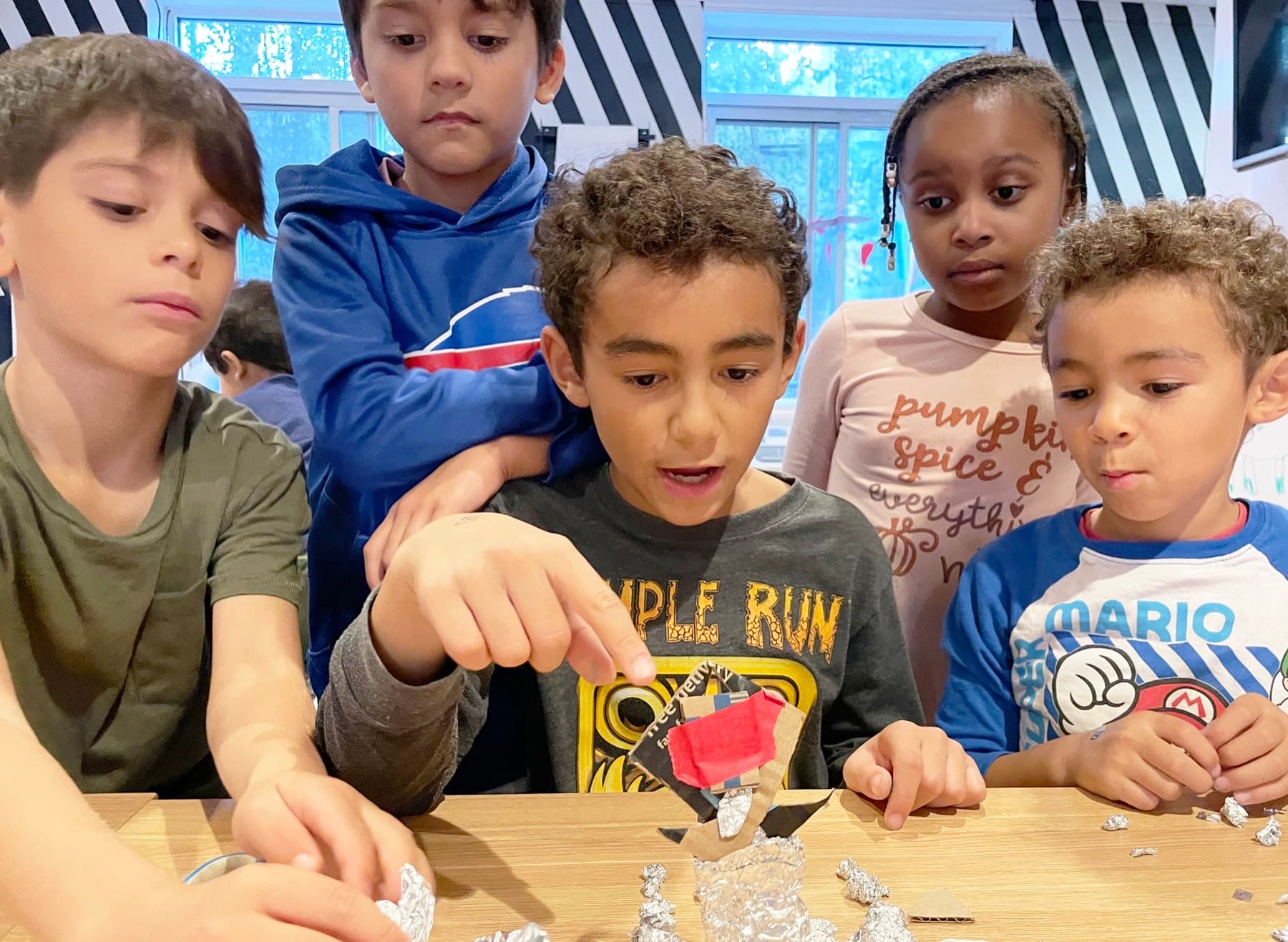 Children building sculptures at PLAYDAY after school